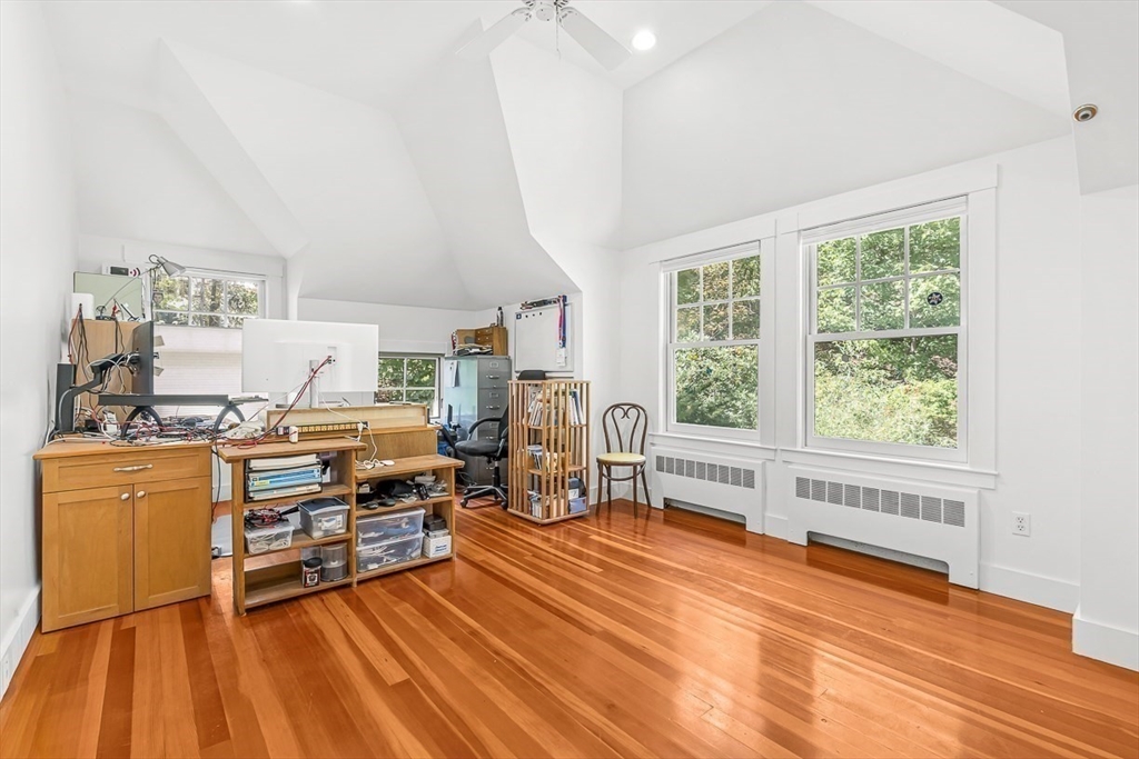 55 Pleasant Street Lexington, MA 02421 - Photo 35 of 42 a living room with furniture and a wooden floor