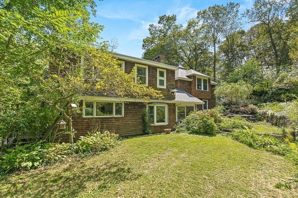 55 Pleasant Street Lexington, MA 02421 - Photo 38 of 42 front view of a house with a yard