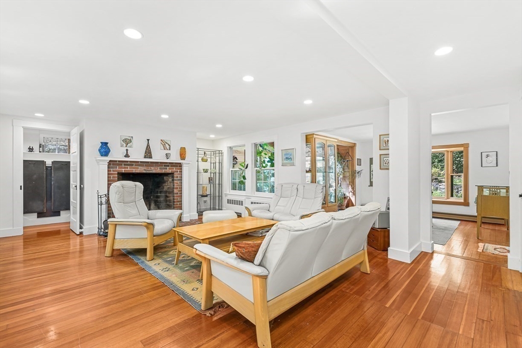 55 Pleasant Street Lexington, MA 02421 - Photo 8 of 42 a living room with furniture and a fireplace