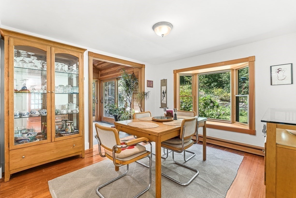 55 Pleasant Street Lexington, MA 02421 - Photo 10 of 42 a view of a dining room with furniture window and wooden floor
