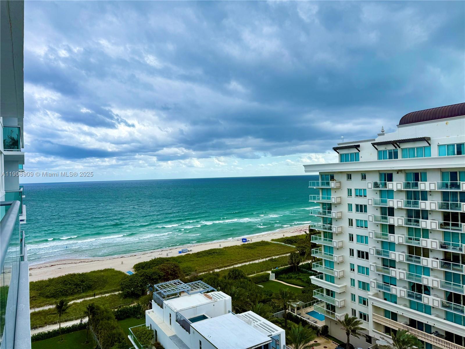 9511 Collins Avenue, Unit 1208 Surfside, FL 33154 - Photo 1 of 37 a view of a city from a lake