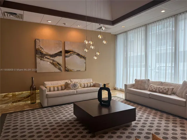 a living room with furniture and a rug