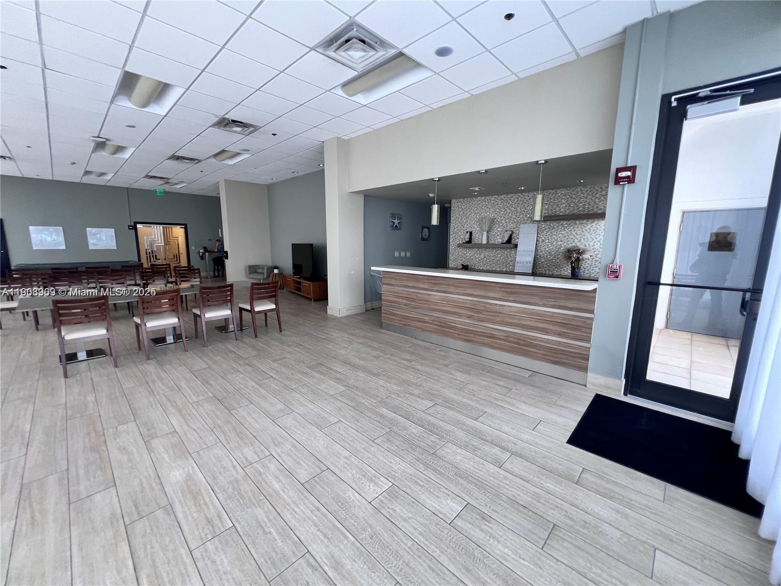9511 Collins Avenue, Unit 1208 Surfside, FL 33154 - Photo 36 of 37 a view of a livingroom with furniture wooden floor and windows