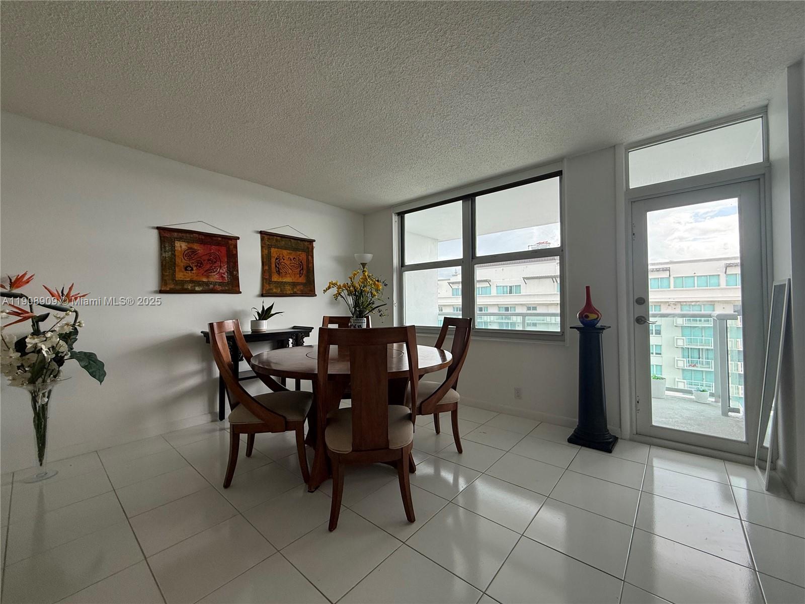 9511 Collins Avenue, Unit 1208 Surfside, FL 33154 - Photo 9 of 37 a view of a dining room with furniture and window