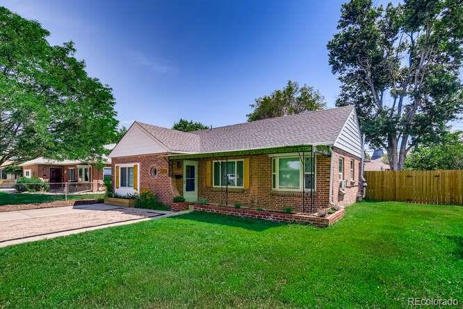 3880 Quay Street Wheat Ridge, CO 80033 - Photo 1 of 32 a front view of house with yard and green space