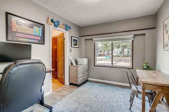 3880 Quay Street Wheat Ridge, CO 80033 - Photo 14 of 32 a workspace with furniture and a window