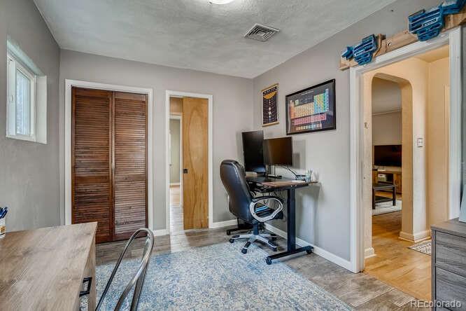 3880 Quay Street Wheat Ridge, CO 80033 - Photo 15 of 32 a view of a livingroom with workspace and a window
