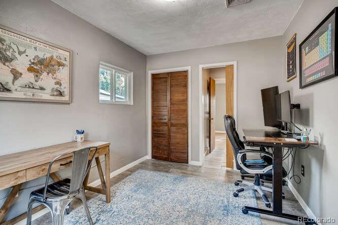 3880 Quay Street Wheat Ridge, CO 80033 - Photo 16 of 32 a view of a workspace with furniture and a window