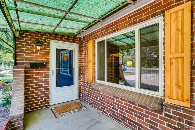 3880 Quay Street Wheat Ridge, CO 80033 - Photo 2 of 32 a view of a house with a large window