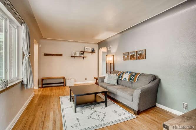 3880 Quay Street Wheat Ridge, CO 80033 - Photo 25 of 32 a living room with furniture and a rug