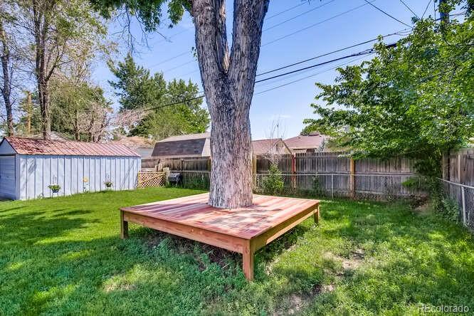 3880 Quay Street Wheat Ridge, CO 80033 - Photo 26 of 32 a view of a backyard with a tree