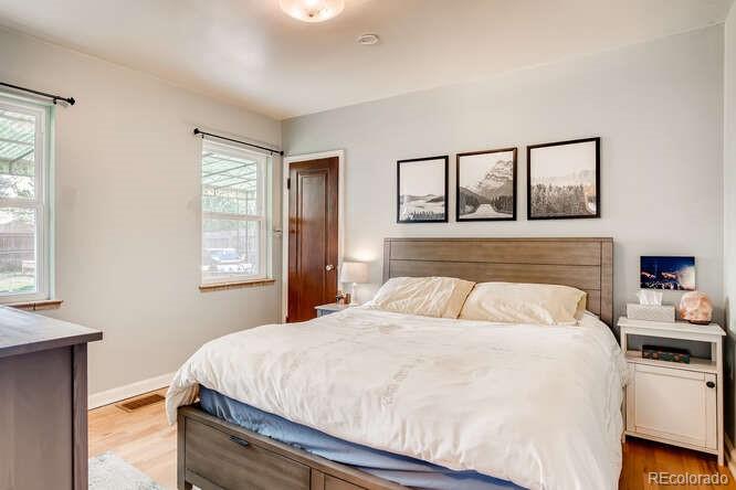 3880 Quay Street Wheat Ridge, CO 80033 - Photo 7 of 32 a bedroom with a bed and a window