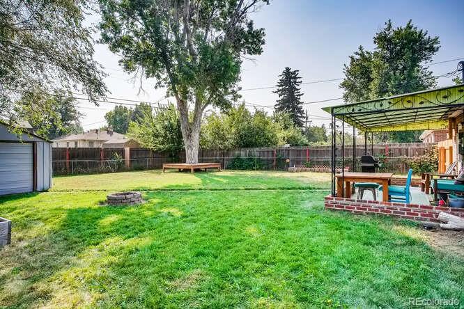 3880 Quay Street Wheat Ridge, CO 80033 - Photo 10 of 32 a view of a yard with a slide