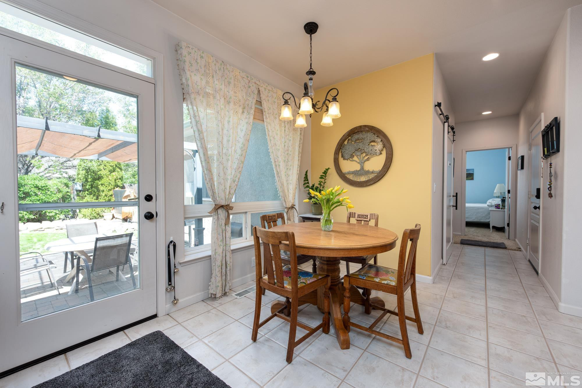 971 Fieldgate Way Gardnerville, NV 89460 - Photo 13 of 57 a view of a dining room with furniture window and outside view
