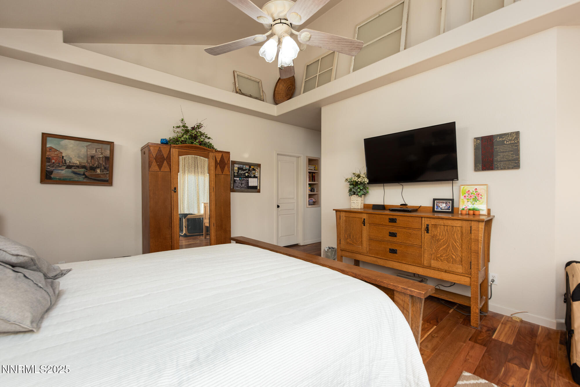 971 Fieldgate Way Gardnerville, NV 89460 - Photo 16 of 57 a bedroom with a bed and a flat screen tv