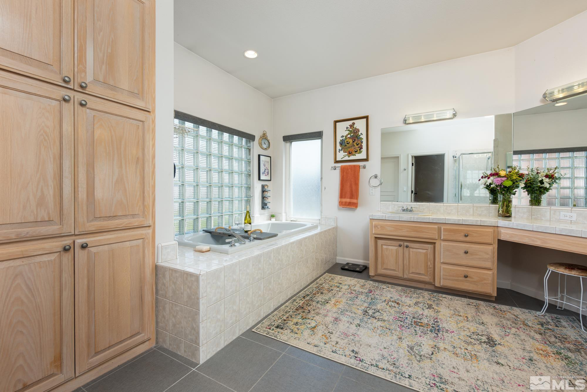 971 Fieldgate Way Gardnerville, NV 89460 - Photo 17 of 57 a large bathroom with a sink mirror and a bath tub