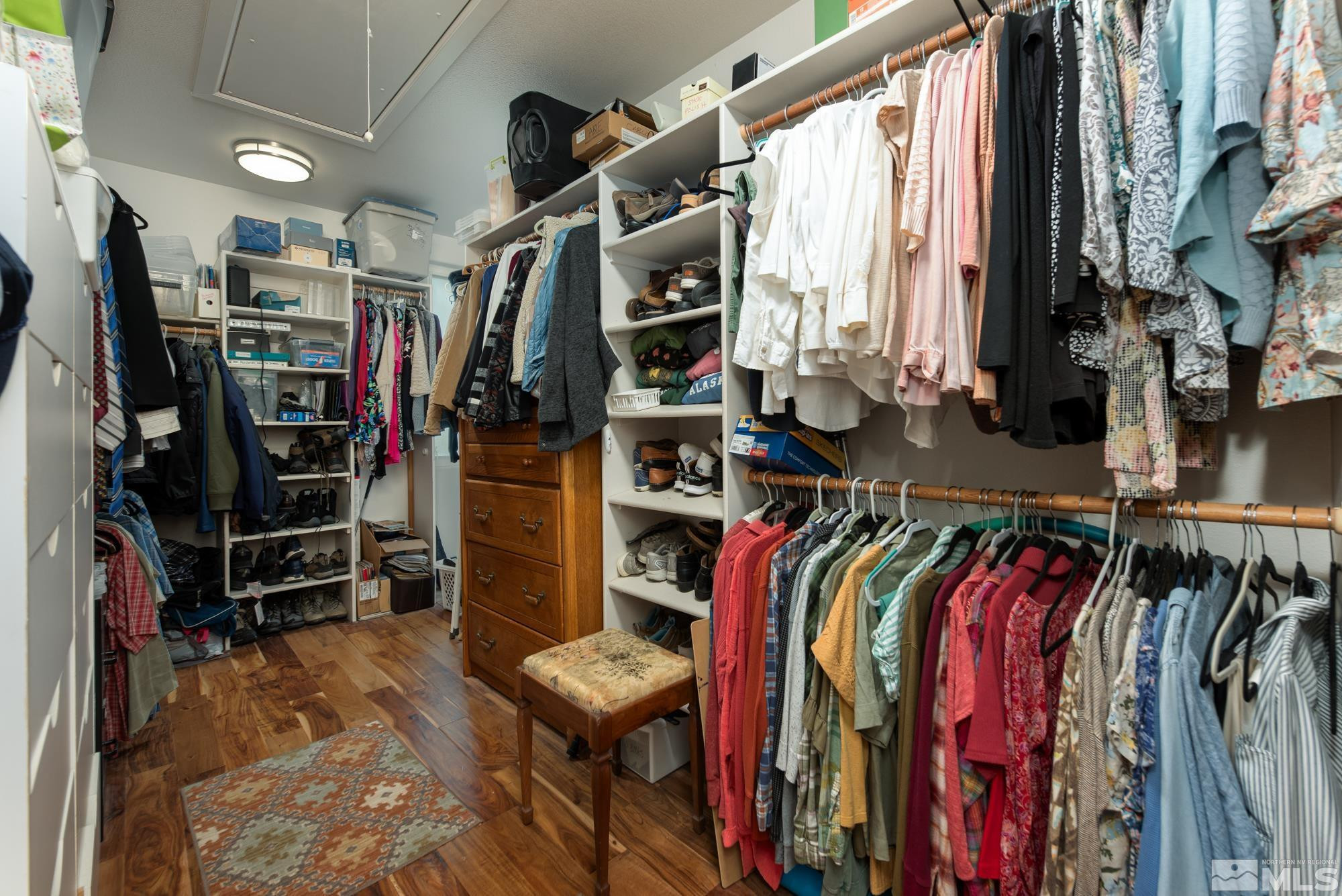 971 Fieldgate Way Gardnerville, NV 89460 - Photo 19 of 57 a view of walk in closet with clothes and shoes