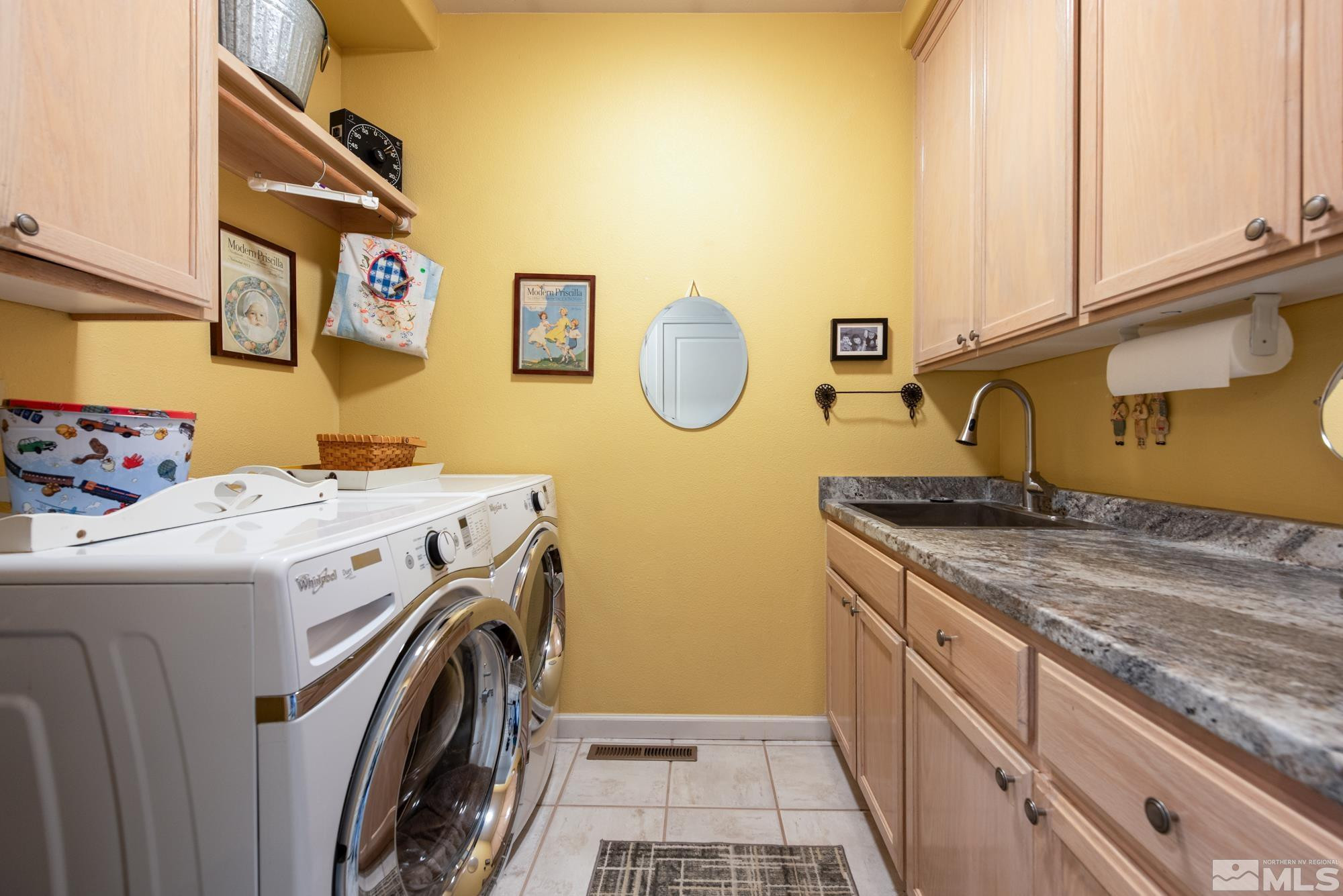 971 Fieldgate Way Gardnerville, NV 89460 - Photo 20 of 57 a utility room with dryer and washer