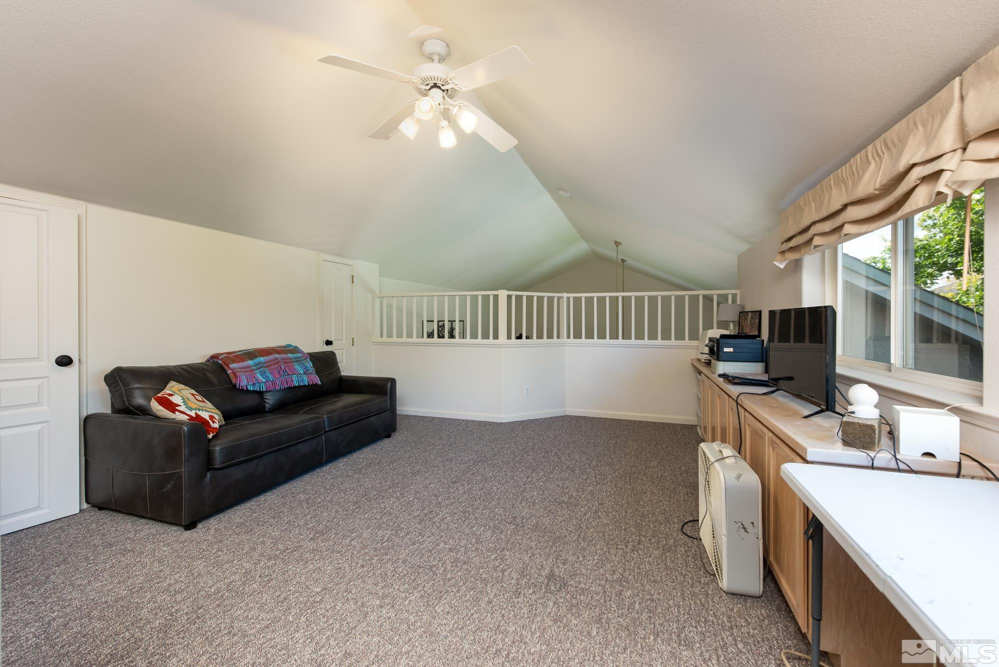 971 Fieldgate Way Gardnerville, NV 89460 - Photo 27 of 57 a living room with furniture and a flat screen tv