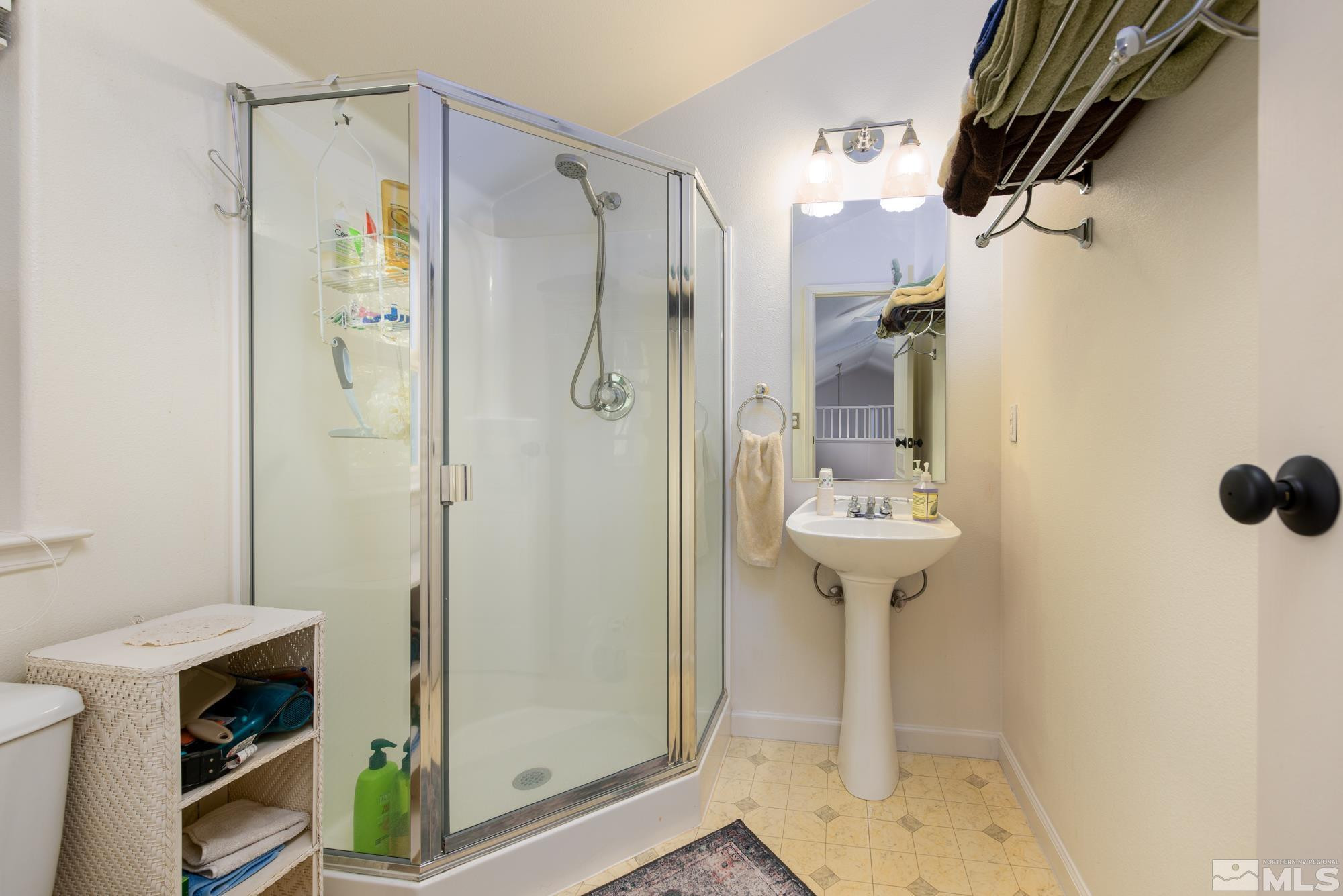 971 Fieldgate Way Gardnerville, NV 89460 - Photo 29 of 57 a bathroom with a shower and a sink