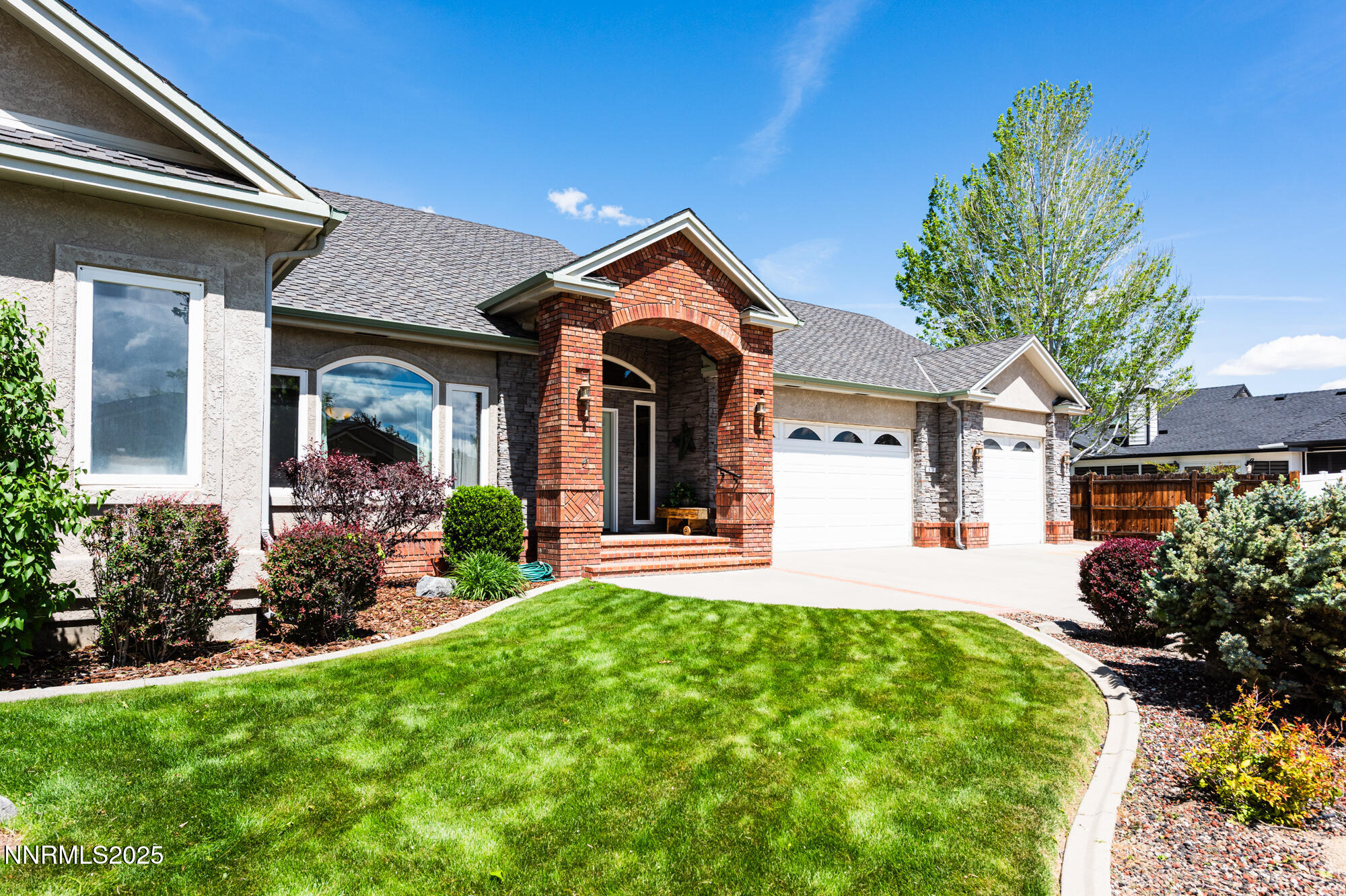 971 Fieldgate Way Gardnerville, NV 89460 - Photo 32 of 57 a front view of a house with garden