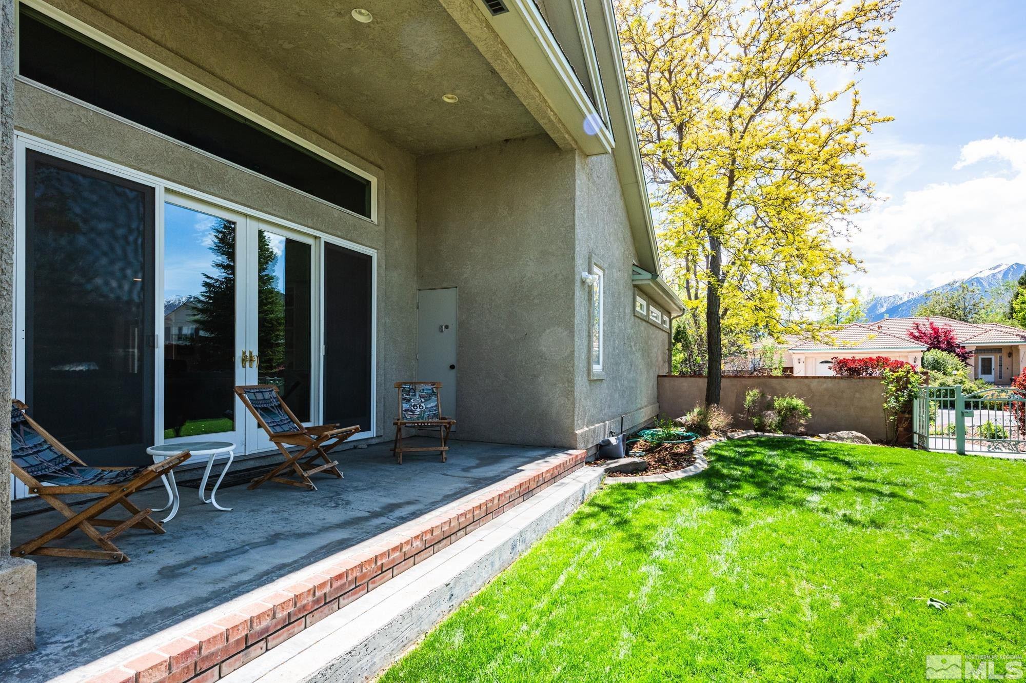 971 Fieldgate Way Gardnerville, NV 89460 - Photo 37 of 57 a view of a patio with chair and tables