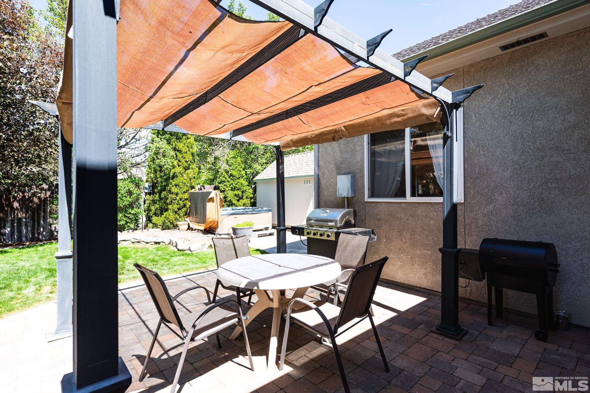 971 Fieldgate Way Gardnerville, NV 89460 - Photo 40 of 57 a view of patio with table and chairs and potted plants
