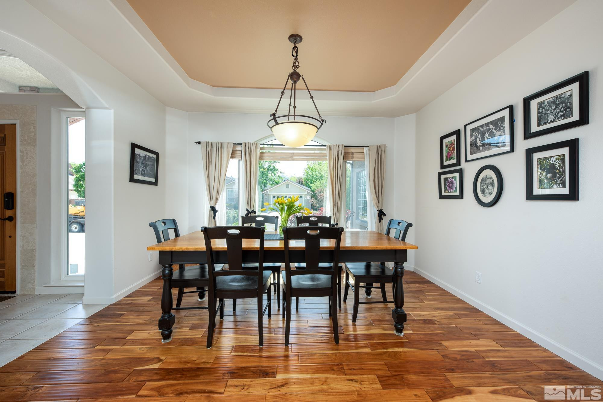 971 Fieldgate Way Gardnerville, NV 89460 - Photo 4 of 57 a view of a dining room with furniture window and wooden floor