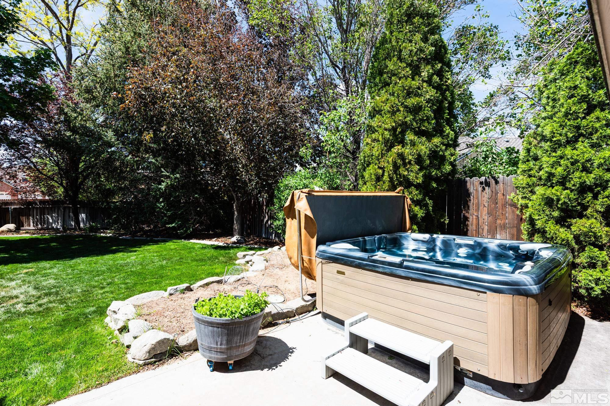 971 Fieldgate Way Gardnerville, NV 89460 - Photo 41 of 57 a backyard of a house with yard and outdoor seating