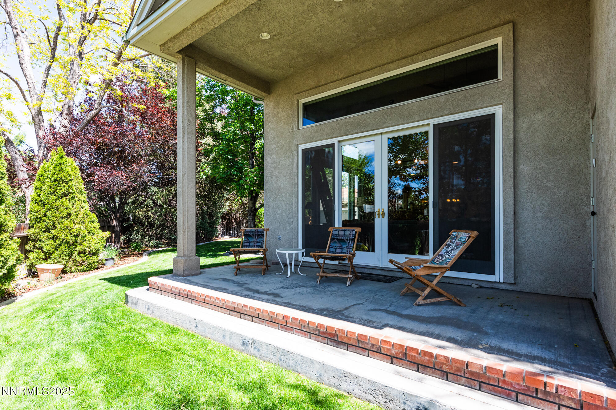 971 Fieldgate Way Gardnerville, NV 89460 - Photo 43 of 57 a view of a two chair in the patio and the front view of a house