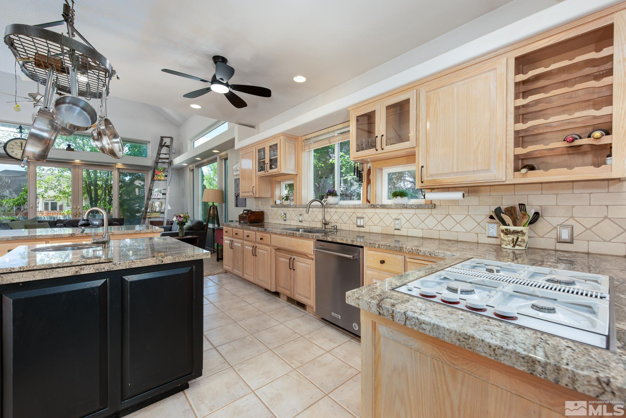 971 Fieldgate Way Gardnerville, NV 89460 - Photo 7 of 57 a kitchen with a sink stove and cabinets