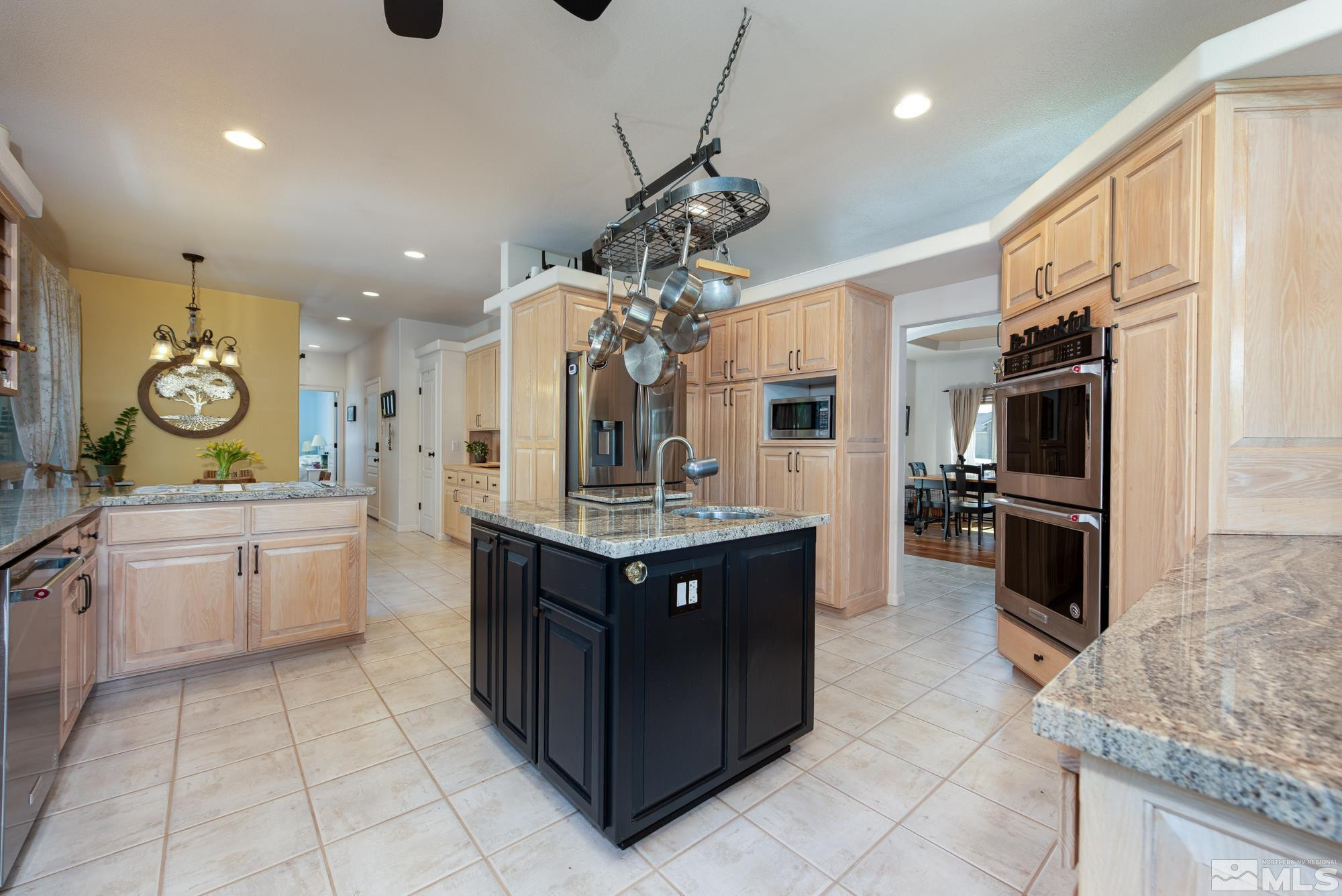 971 Fieldgate Way Gardnerville, NV 89460 - Photo 8 of 57 a kitchen with a sink counter top space appliances and cabinets