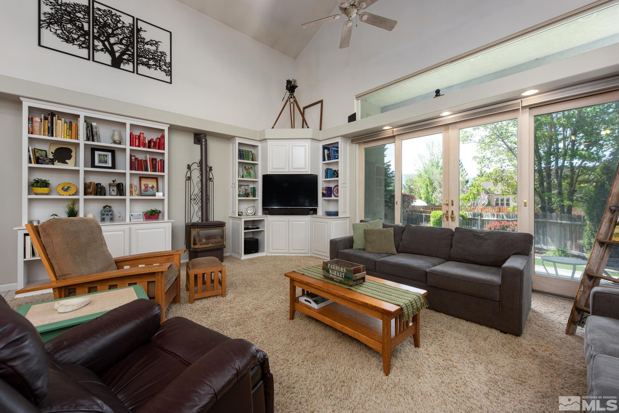 971 Fieldgate Way Gardnerville, NV 89460 - Photo 9 of 57 a living room with furniture flat screen tv and a large window