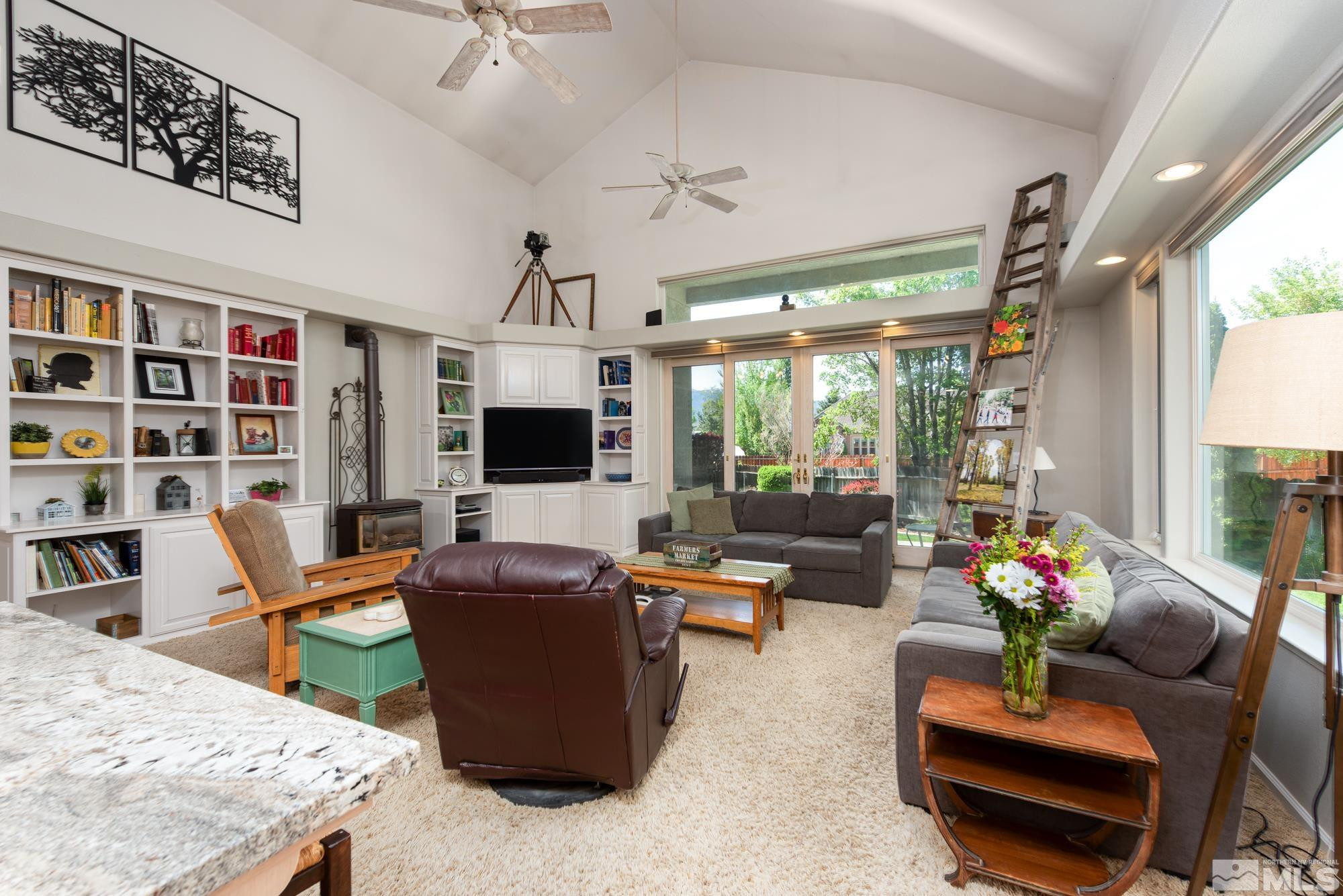 971 Fieldgate Way Gardnerville, NV 89460 - Photo 10 of 57 a living room with furniture flat screen tv and a large window