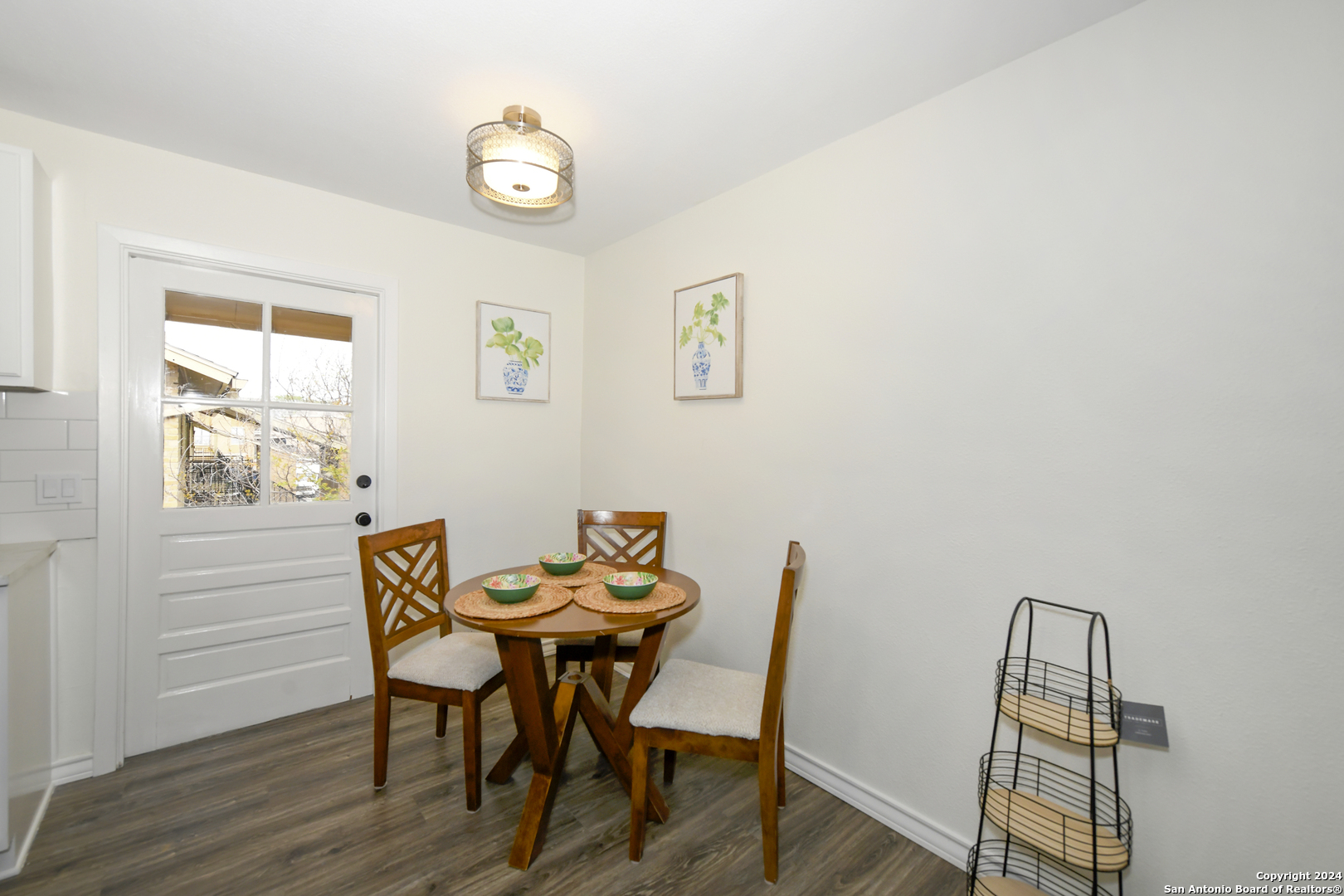 911 Vance Jackson Road, Unit 212 San Antonio, TX 78201 - Photo 11 of 30 a view of a dining room with furniture and wooden floor