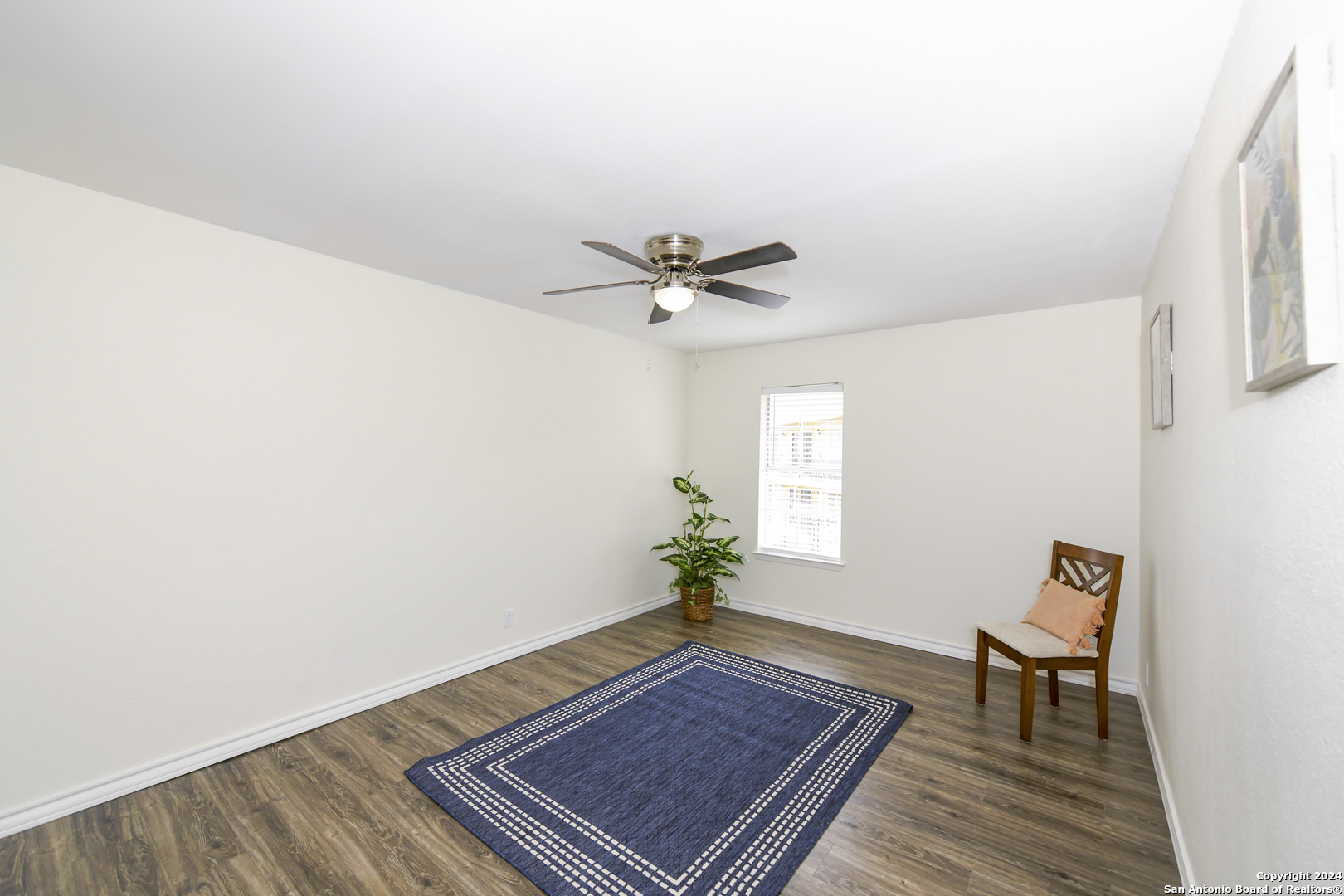 911 Vance Jackson Road, Unit 212 San Antonio, TX 78201 - Photo 13 of 30 a view of livingroom with hardwood floor and a ceiling fan