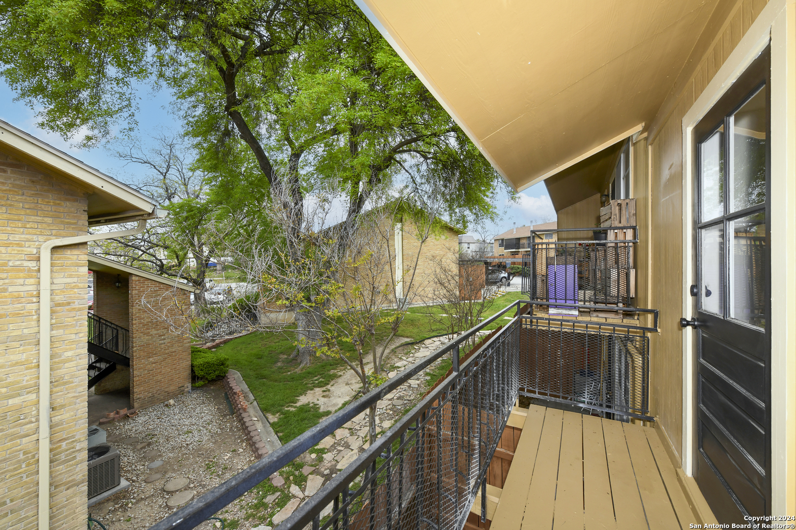911 Vance Jackson Road, Unit 212 San Antonio, TX 78201 - Photo 19 of 30 a view of a backyard with sitting area
