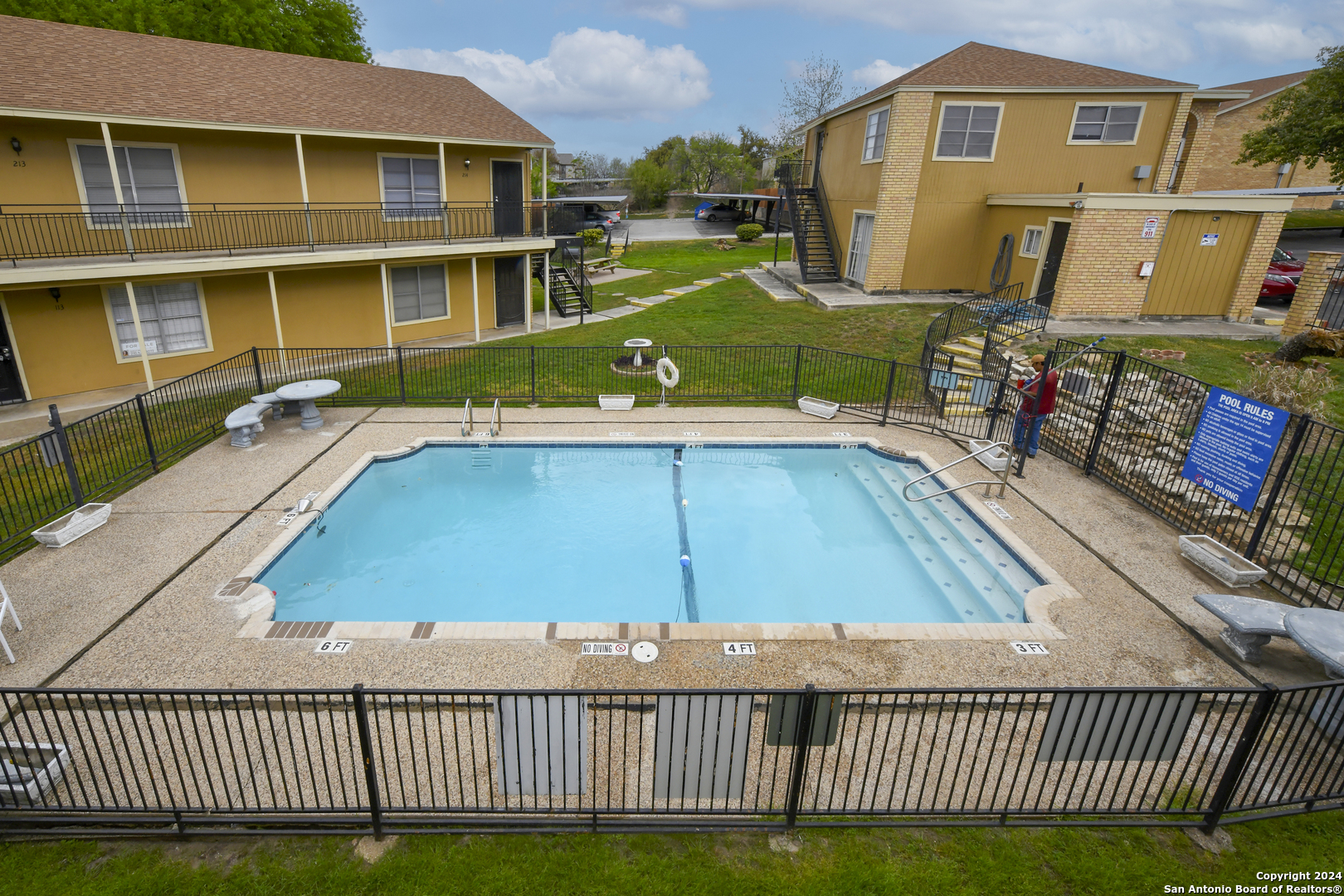 911 Vance Jackson Road, Unit 212 San Antonio, TX 78201 - Photo 20 of 30 a view of a house with a swimming pool