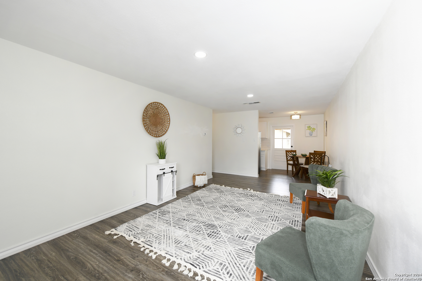 911 Vance Jackson Road, Unit 212 San Antonio, TX 78201 - Photo 7 of 30 a living room with furniture and a wooden floor