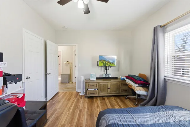 a bedroom with a bed and a walk in closet