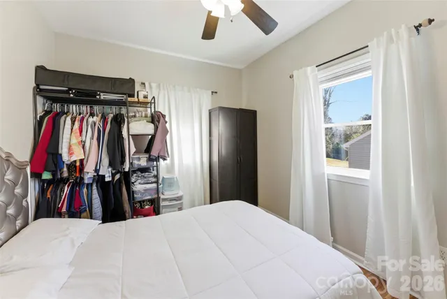 a bedroom with a bed and a closet