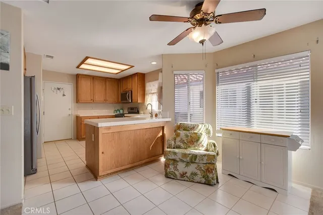 a kitchen with cabinets a sink and appliances