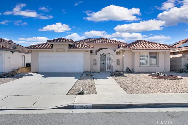 a front view of a house with garage