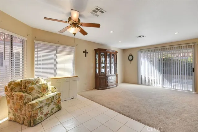 a spacious bedroom with a bed and glass walk in closet