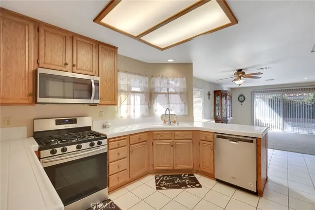 a kitchen with a sink stove top oven and cabinets