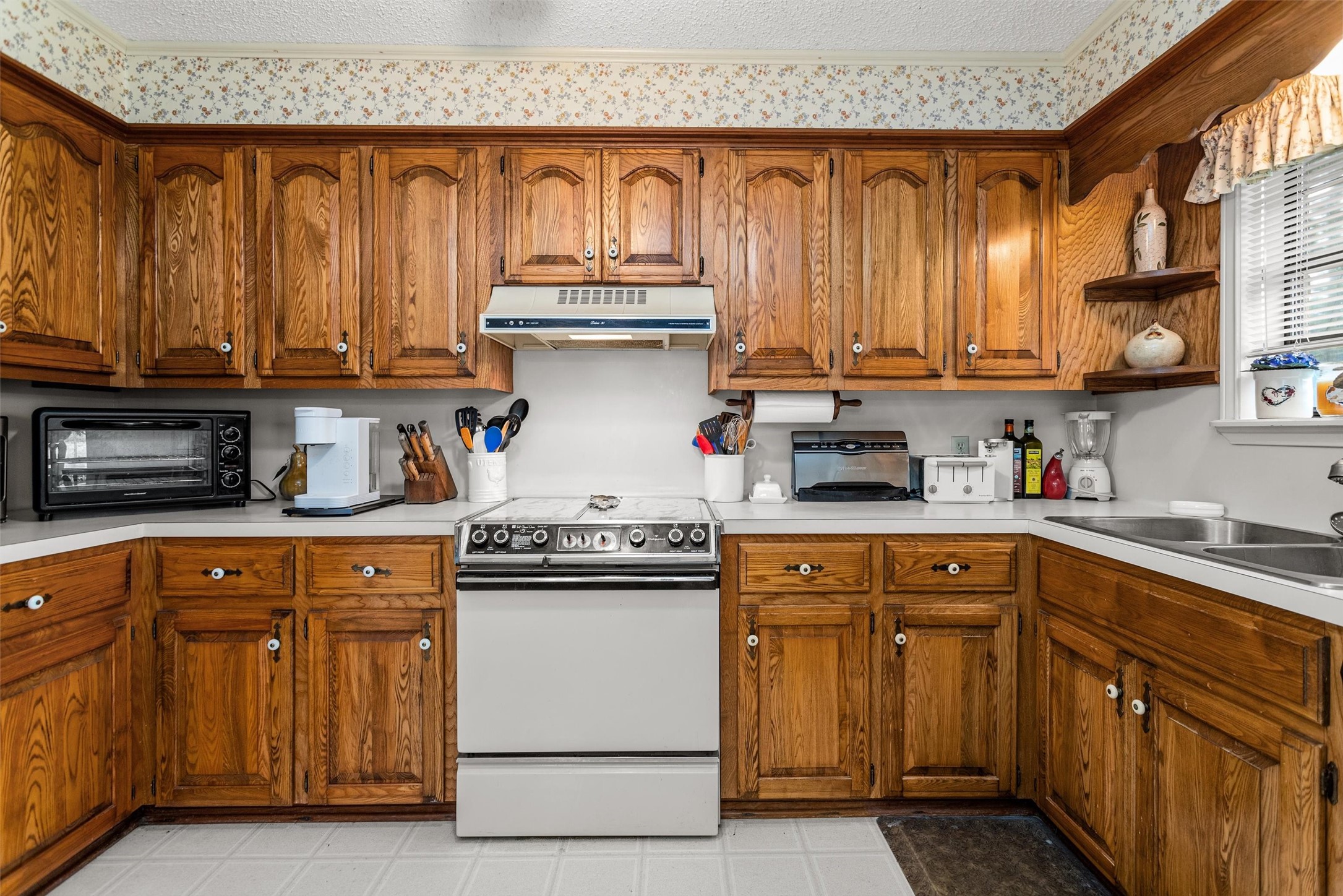 3219 Fm 1817 Elkhart, TX 75839 - Photo 12 of 31 a kitchen with granite countertop wooden cabinets and a sink