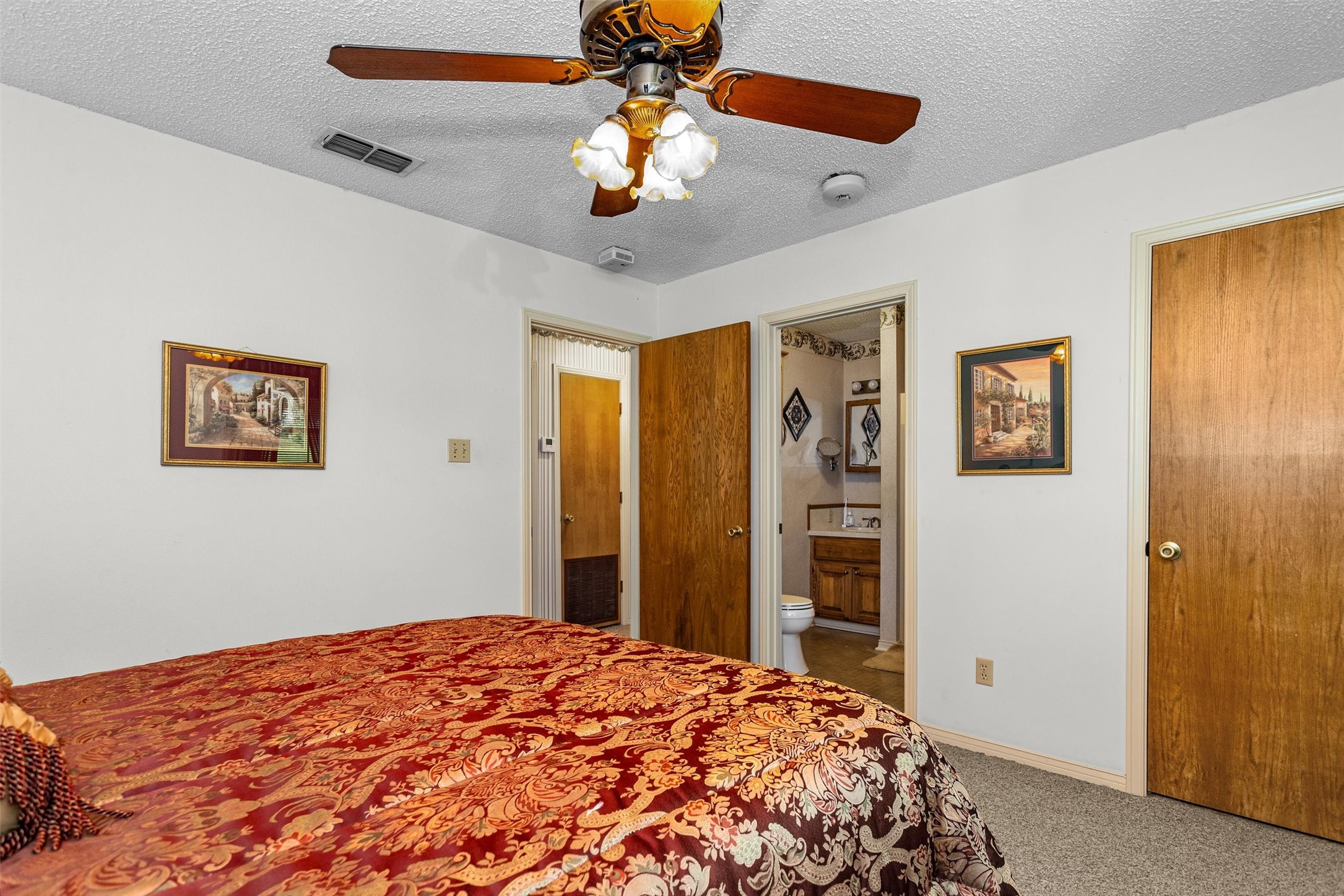3219 Fm 1817 Elkhart, TX 75839 - Photo 17 of 31 a bedroom with a bed and a chandelier