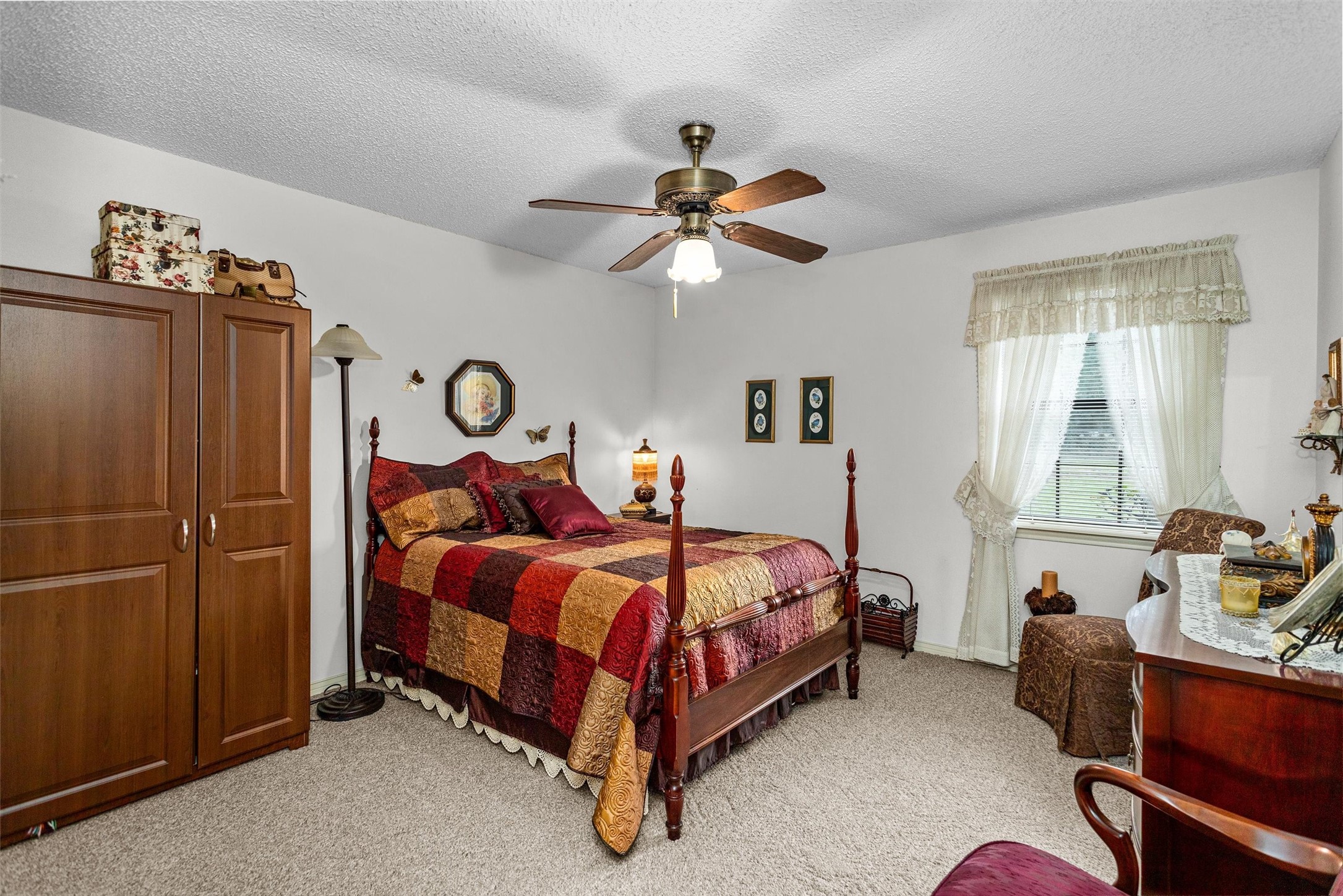 3219 Fm 1817 Elkhart, TX 75839 - Photo 19 of 31 a bed room with a bed and a chandelier