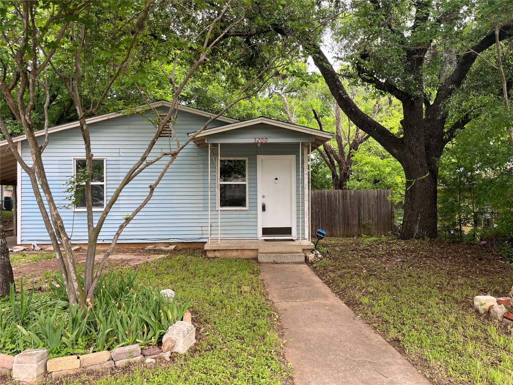 a backyard of a house with seating space