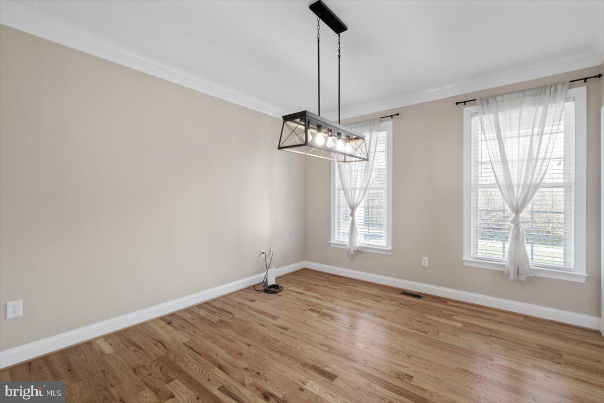 441 Shady Creek Road Clear Brook, VA 22624 - Photo 25 of 46 a view of an empty room with wooden floor and a window